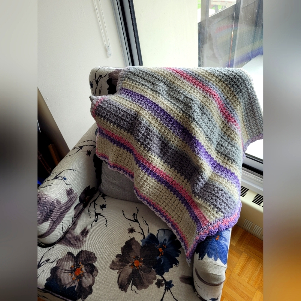 A beautiful crocheted blanket for shall or lap or new born perfect for car pet